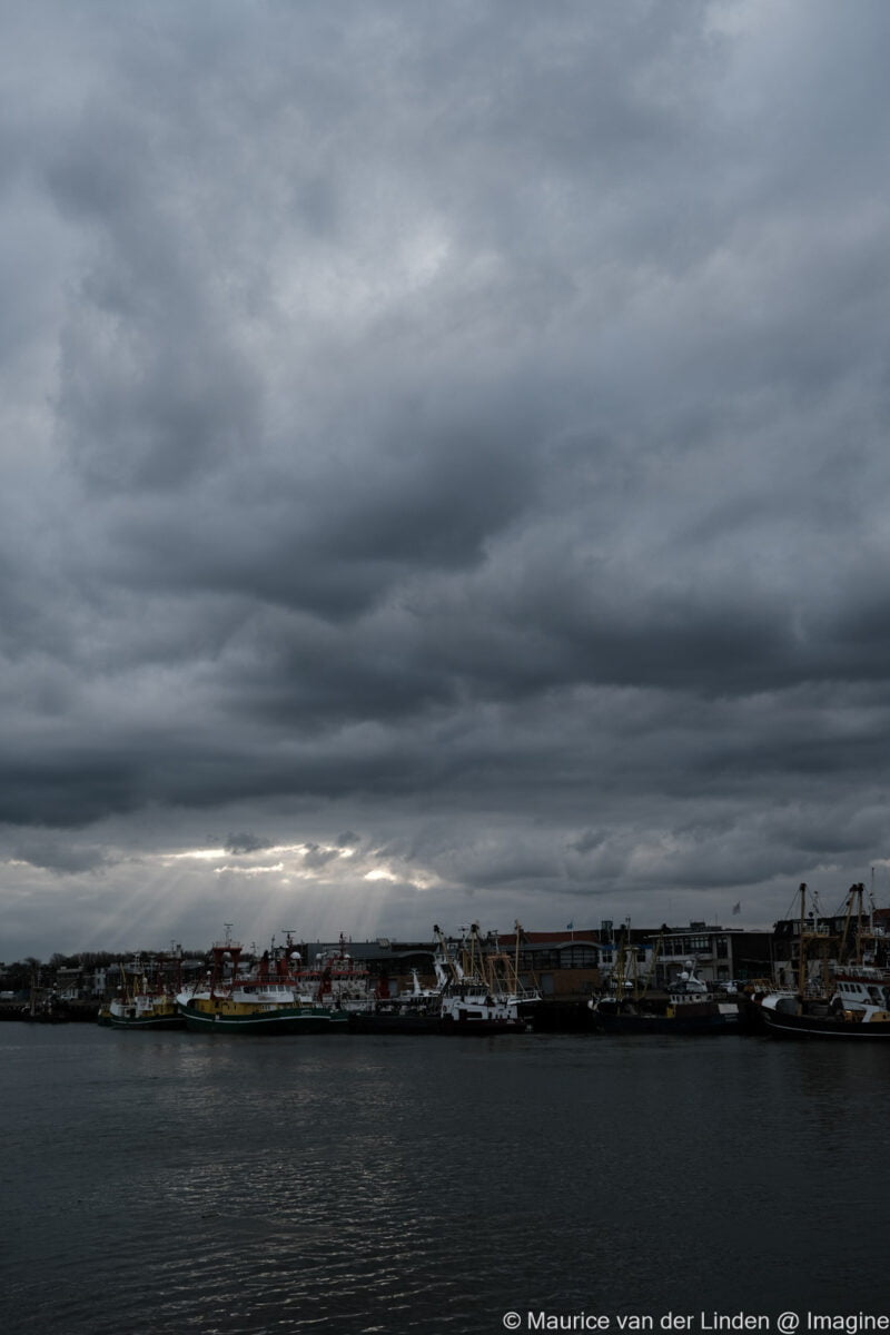 Dark clouds above harbor of IImuiden , Nature photography by Maurice van der Linden